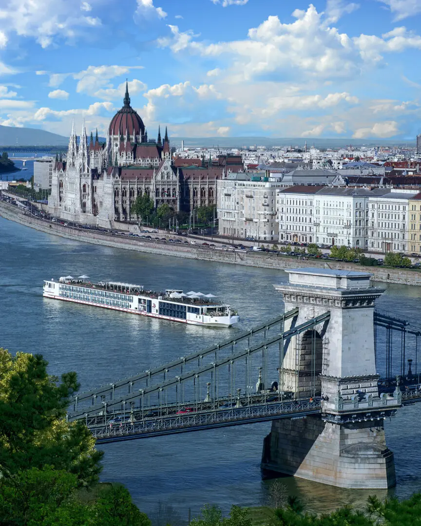 Budapest Parliament, river cruise ship, bridge.