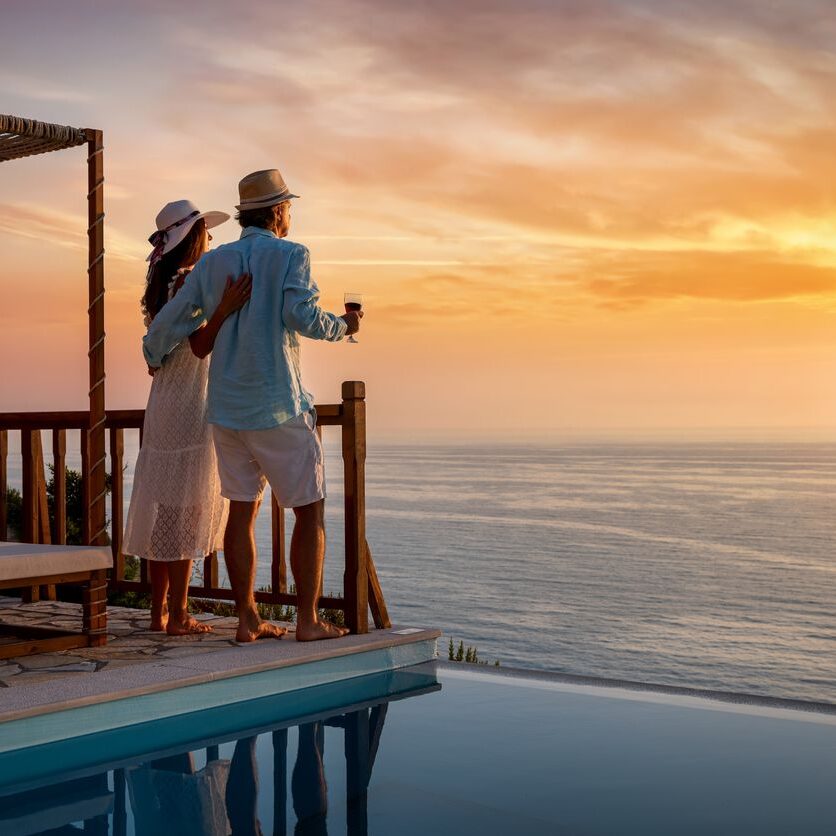 Couple enjoying sunset ocean view.